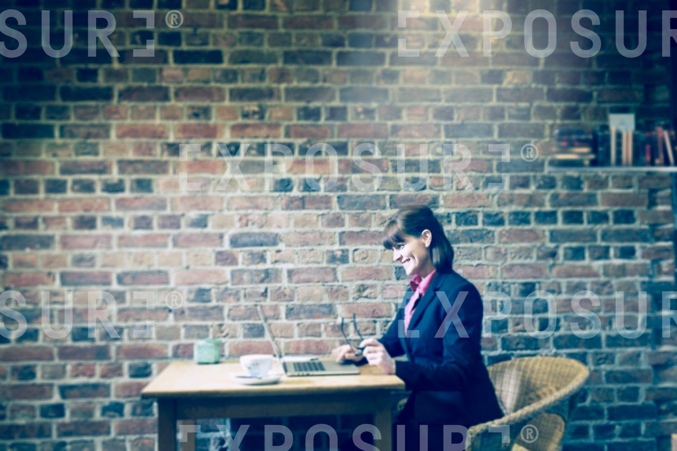 Business Woman Working In Coffee House