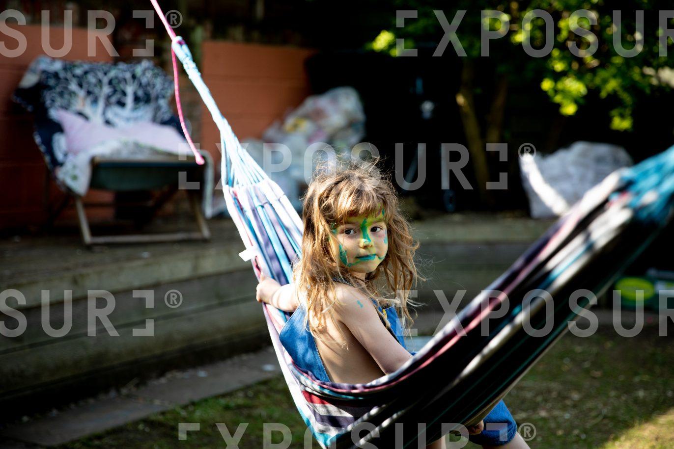 Lockdown diaries – face-painted child playing in garden