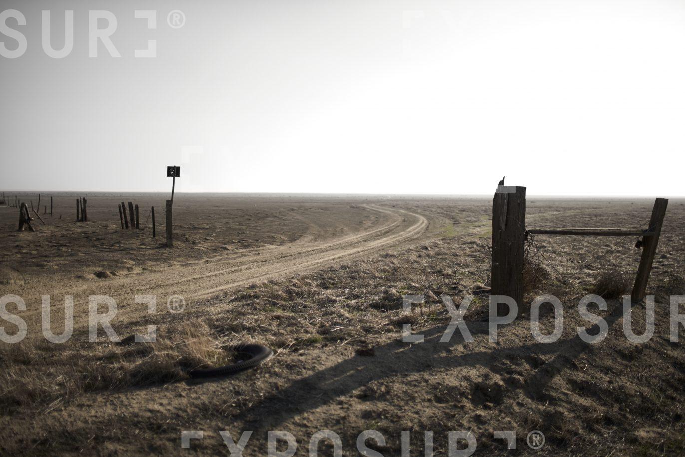 Curving farm track, California desert