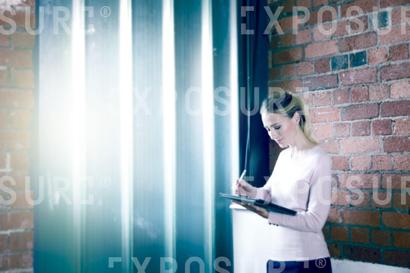 Businesswoman Stood With Tablet